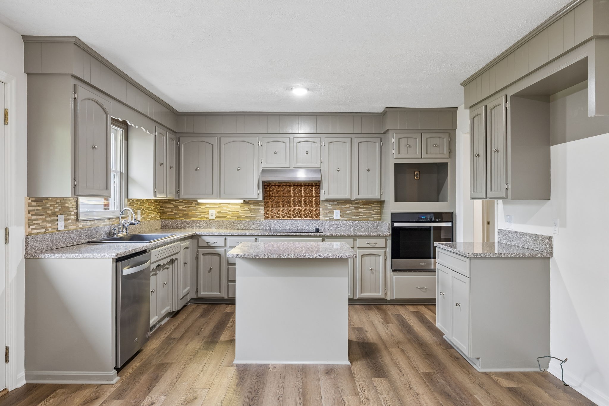 1397 East Blue Creek Road Waverly, TN 37185 - Photo 21 of 93 a kitchen with stainless steel appliances granite countertop a stove top oven a sink dishwasher and a refrigerator