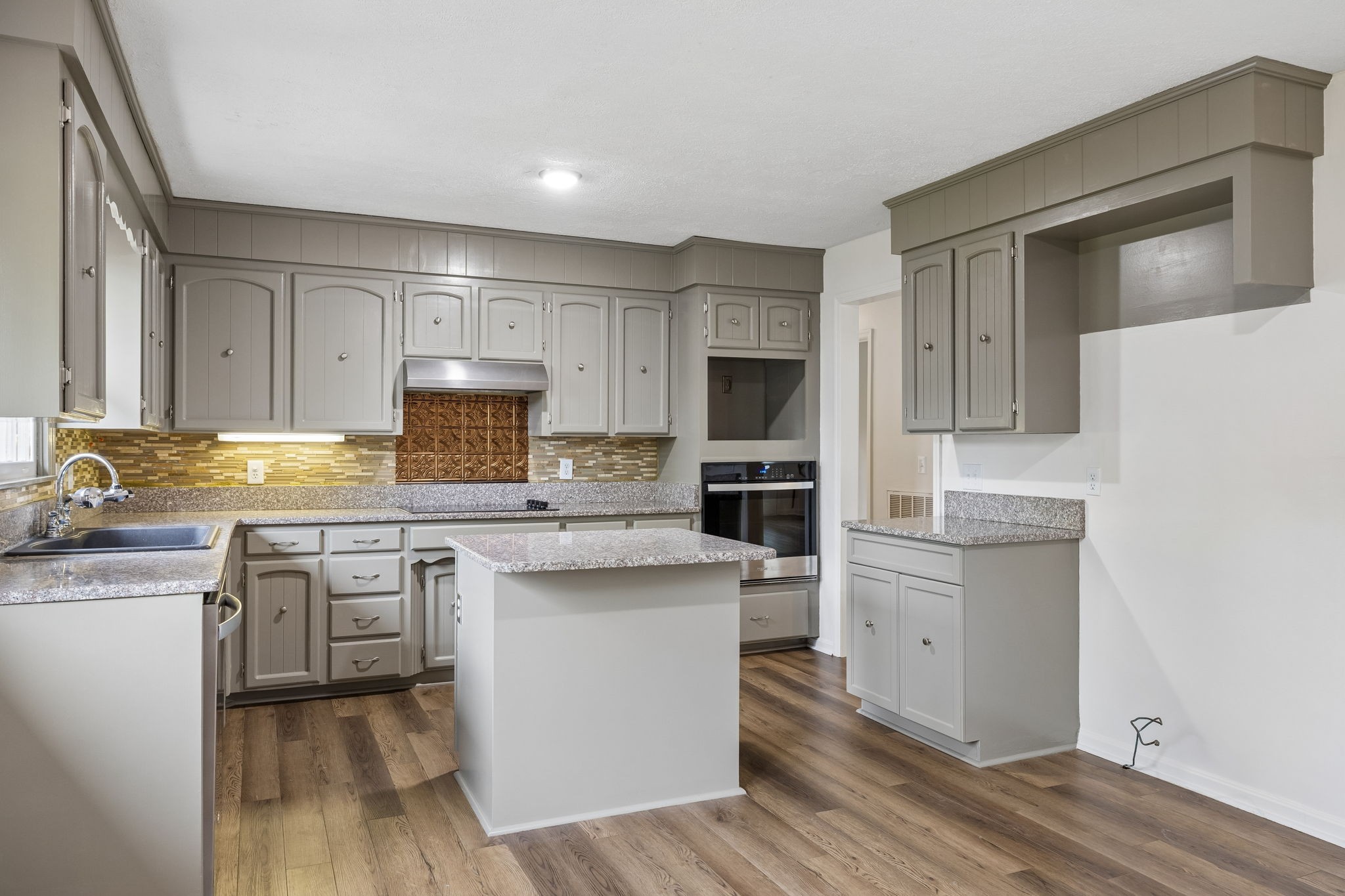 1397 East Blue Creek Road Waverly, TN 37185 - Photo 23 of 93 a kitchen with cabinets a sink and appliances