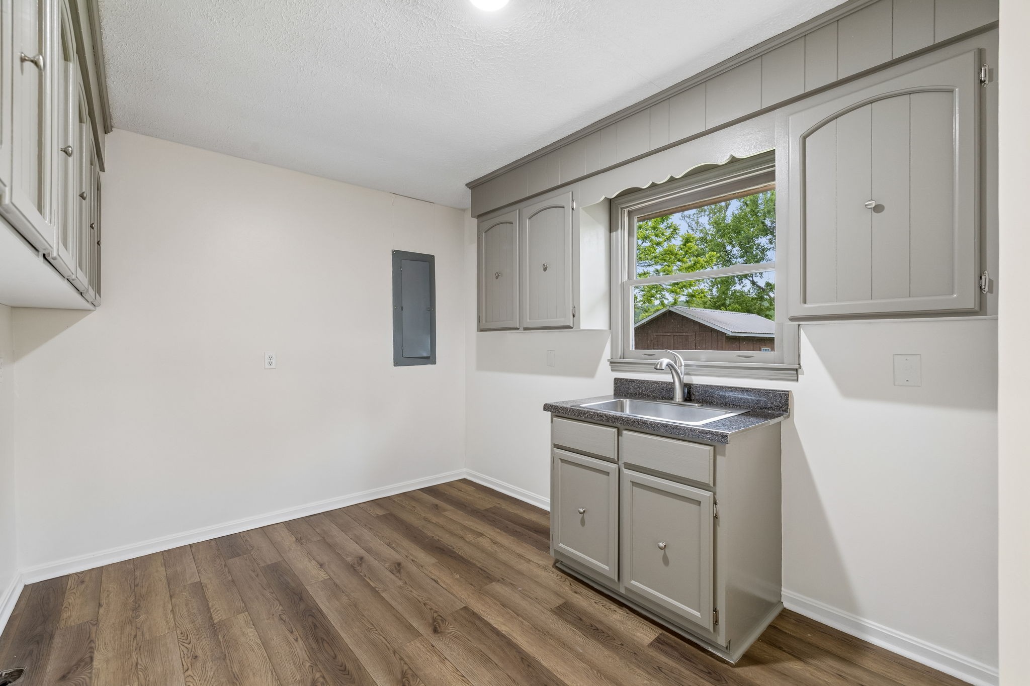 1397 East Blue Creek Road Waverly, TN 37185 - Photo 24 of 93 a kitchen with a sink cabinets appliances and a window