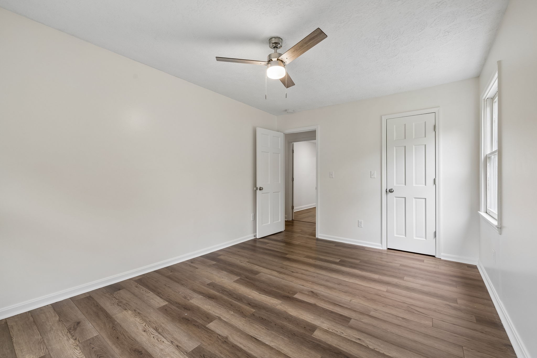 1397 East Blue Creek Road Waverly, TN 37185 - Photo 32 of 93 a view of an empty room with wooden floor