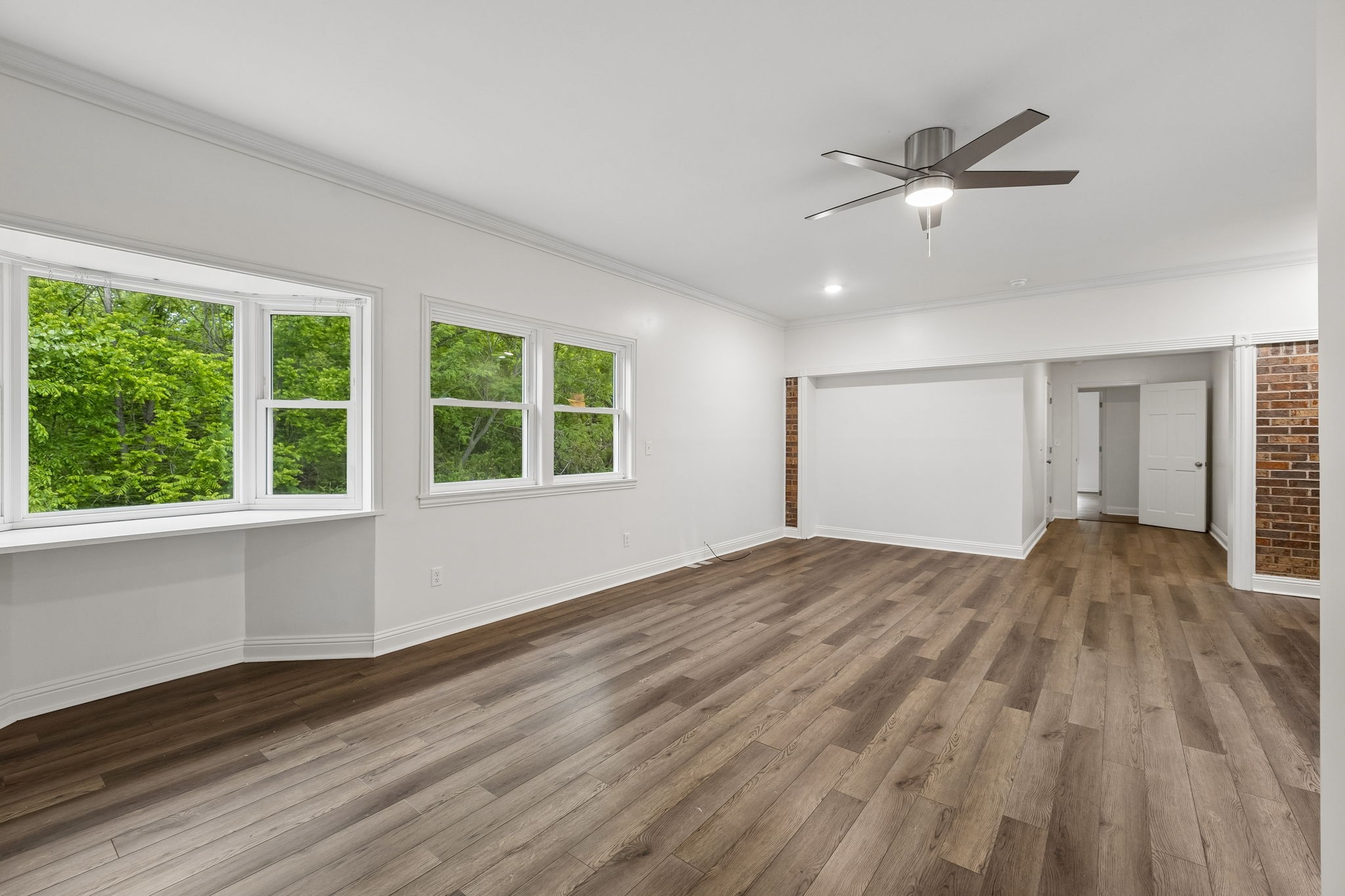 1397 East Blue Creek Road Waverly, TN 37185 - Photo 35 of 93 a view of empty room with wooden floor and fan