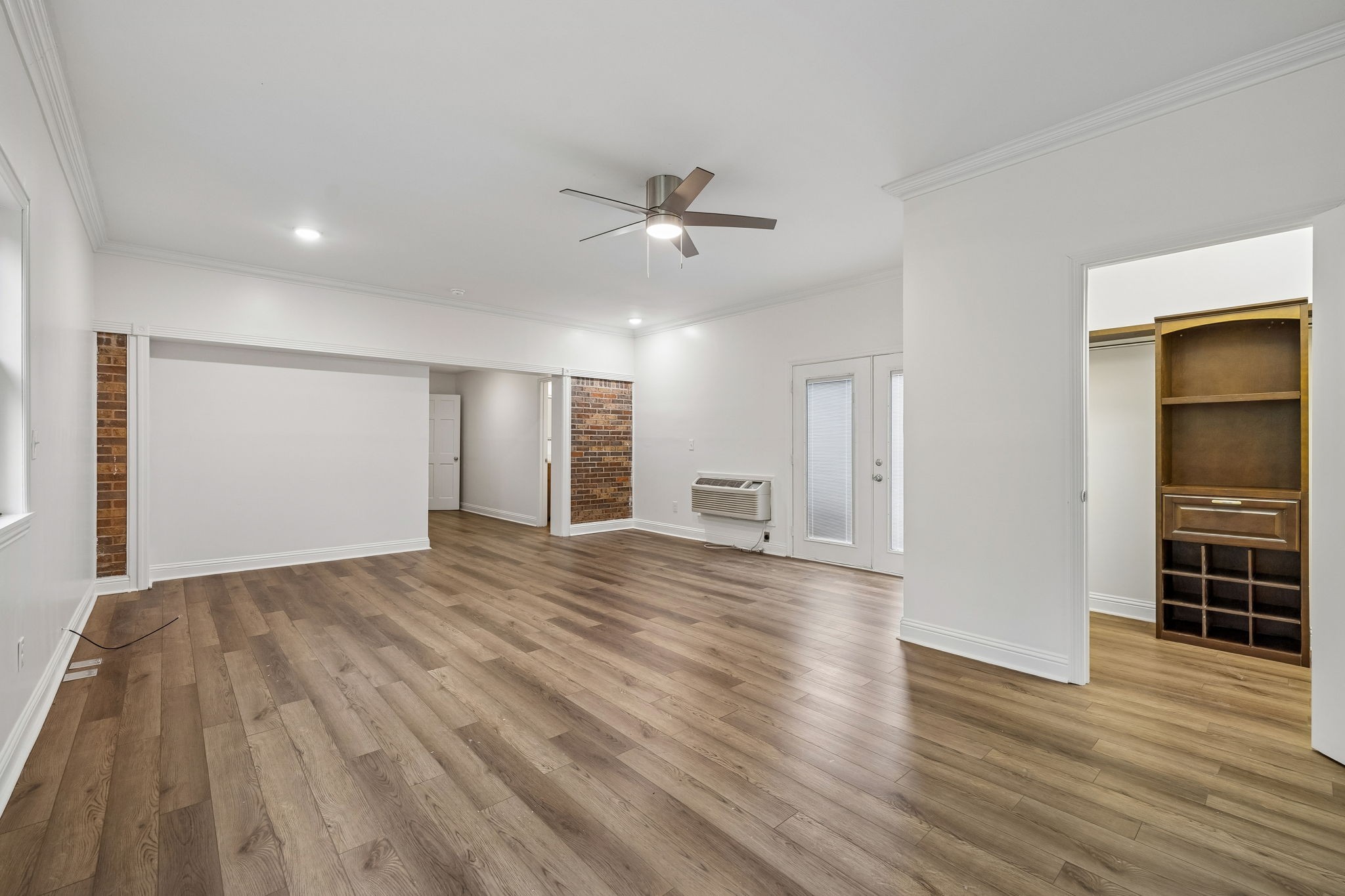 1397 East Blue Creek Road Waverly, TN 37185 - Photo 36 of 93 a view of empty room with wooden floor and ceiling fan