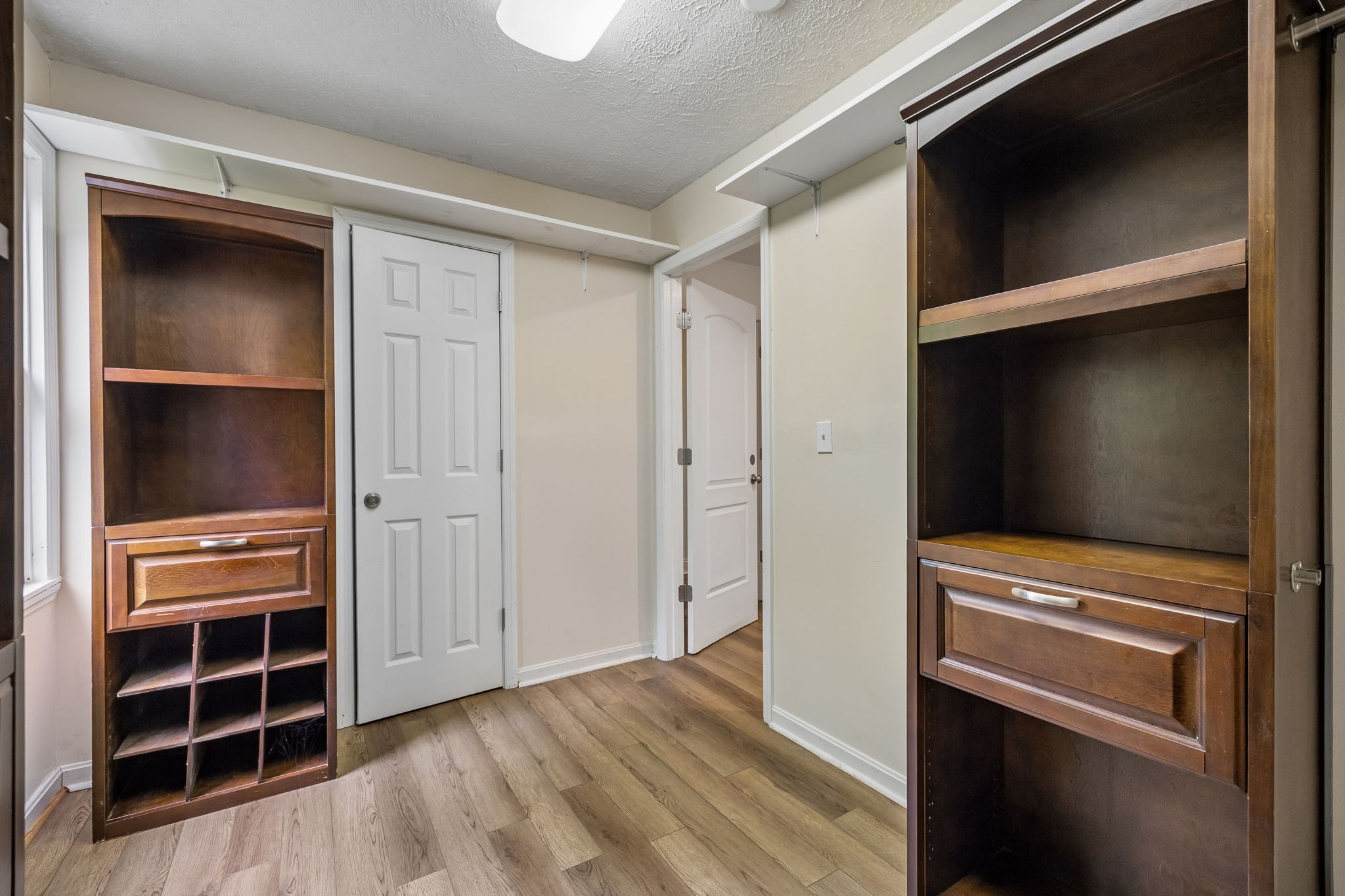 1397 East Blue Creek Road Waverly, TN 37185 - Photo 40 of 93 a view of walk in closet with empty racks