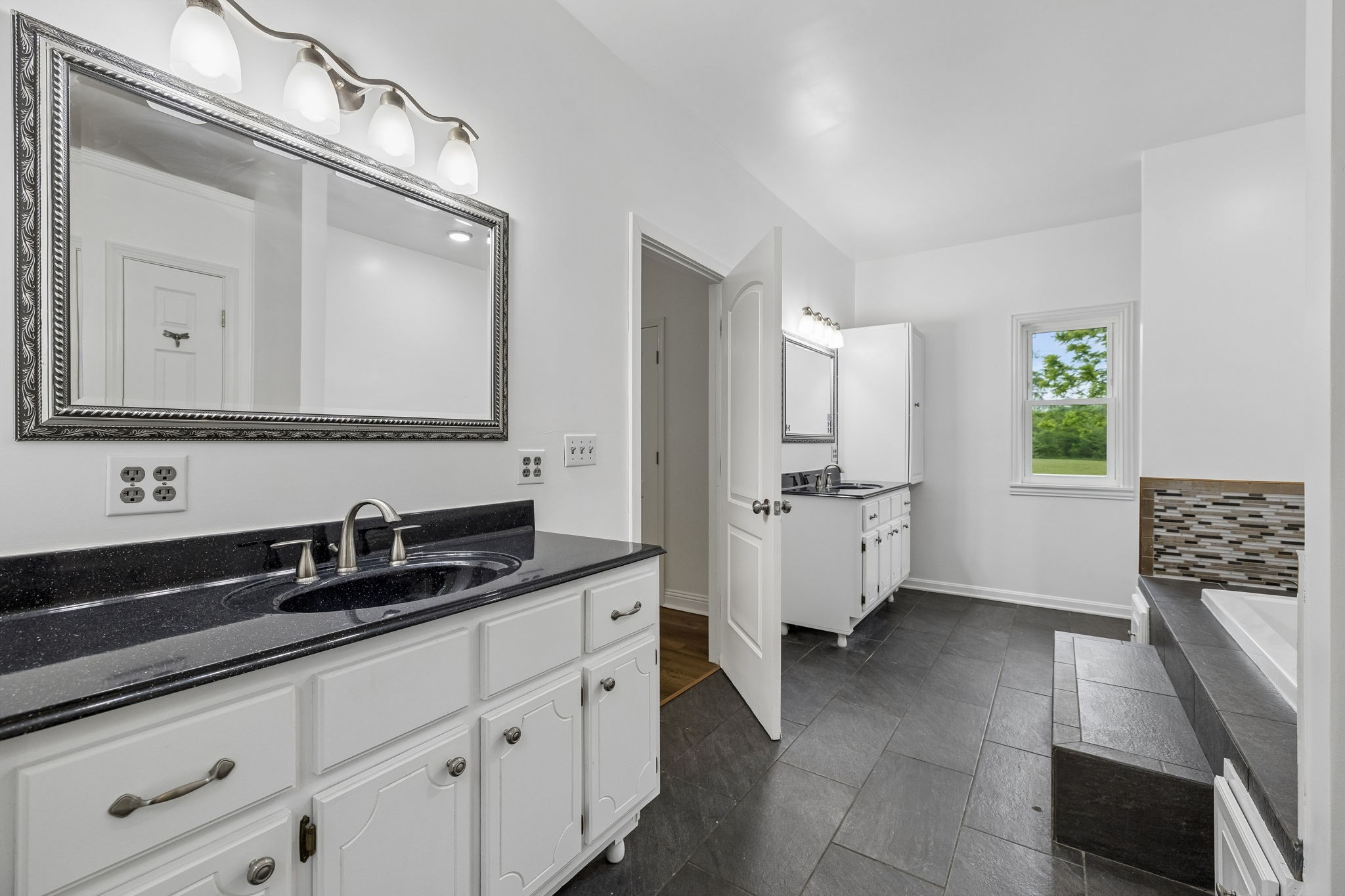 1397 East Blue Creek Road Waverly, TN 37185 - Photo 45 of 93 a en suite bathroom with double sink and a mirror