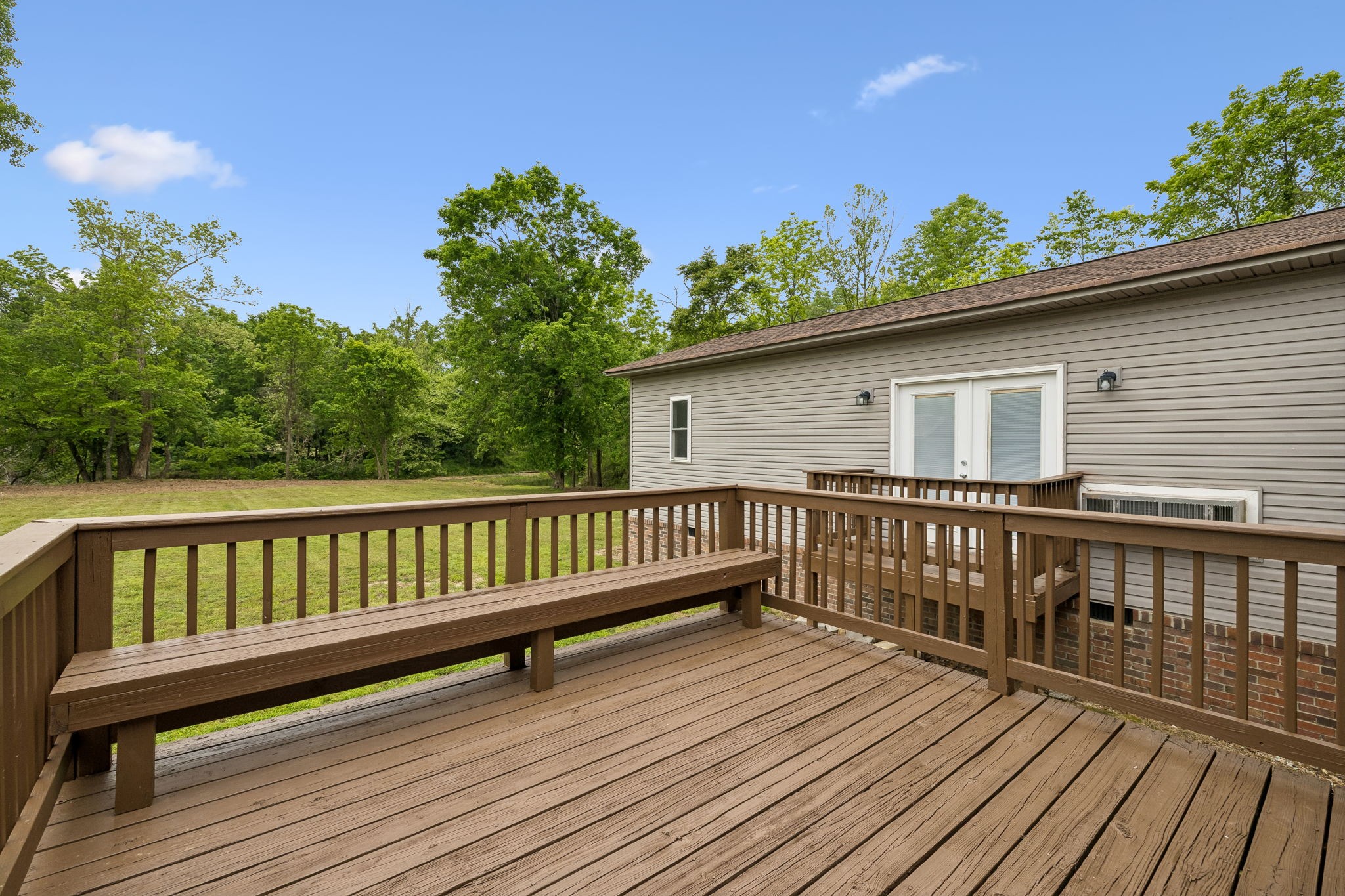 1397 East Blue Creek Road Waverly, TN 37185 - Photo 47 of 93 a view of a wooden deck with a yard