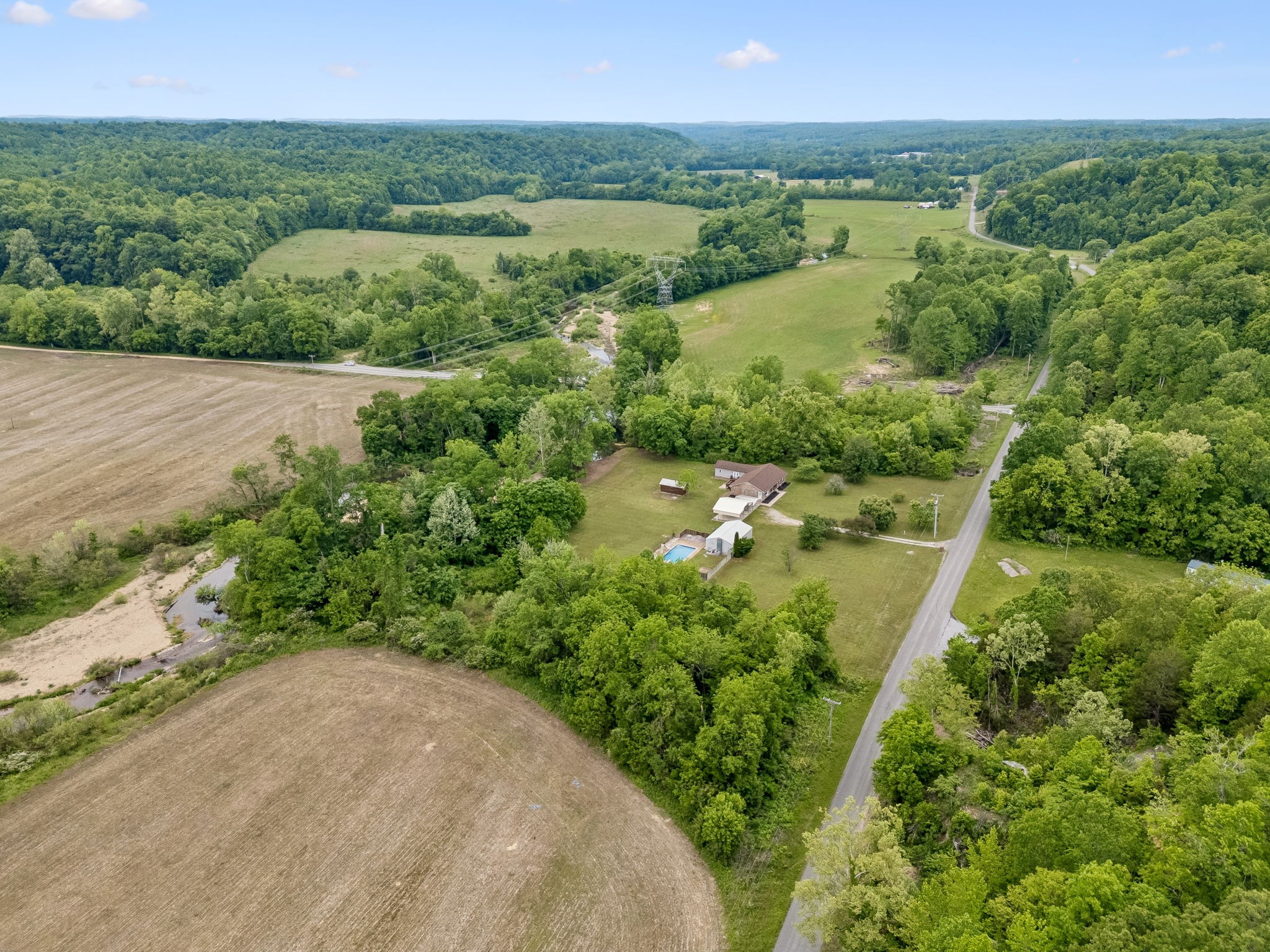 1397 East Blue Creek Road Waverly, TN 37185 - Photo 77 of 93 an aerial view of green landscape with trees houses and lake view