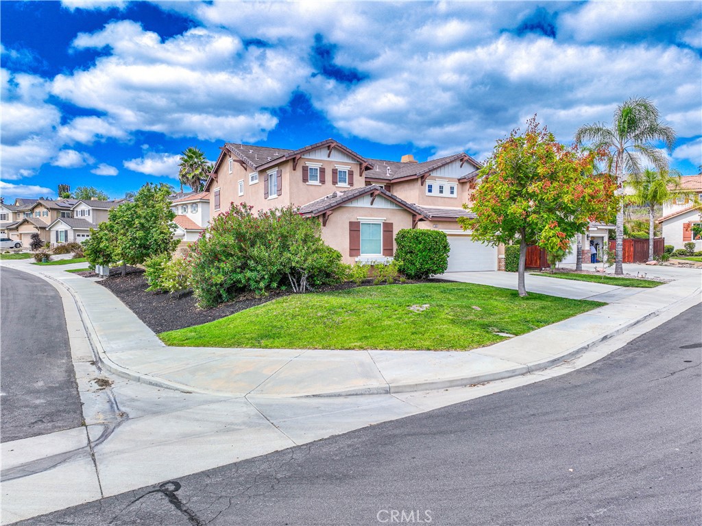 39603 Meadow View Circle Temecula, CA 92591 - Photo 1 of 1 a view of a garden with a house in the background