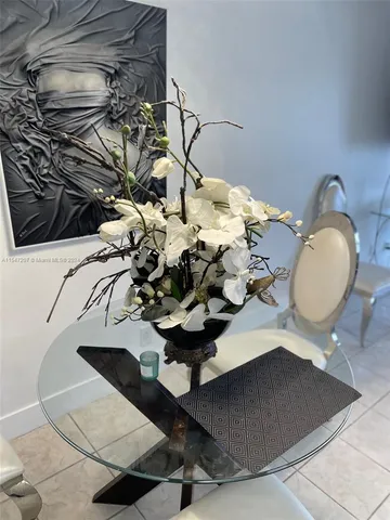 a vase of flowers sitting on a table