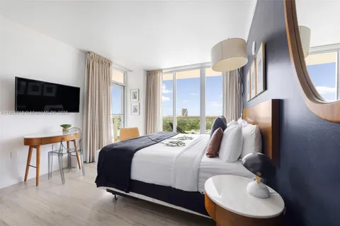 a bathroom with a sink a mirror and a bathtub