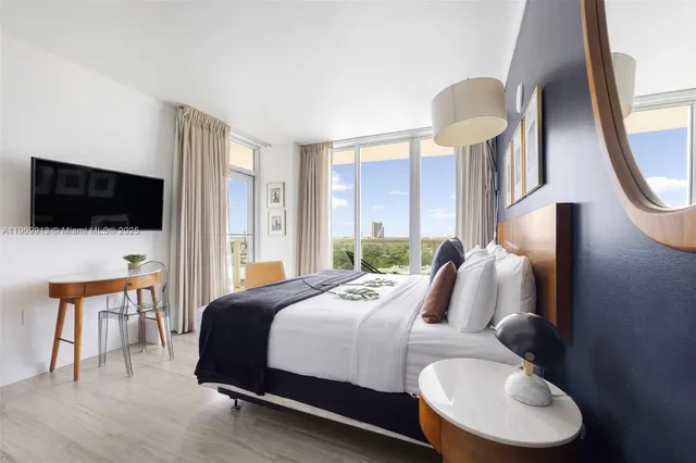 a bathroom with a sink a mirror and a bathtub