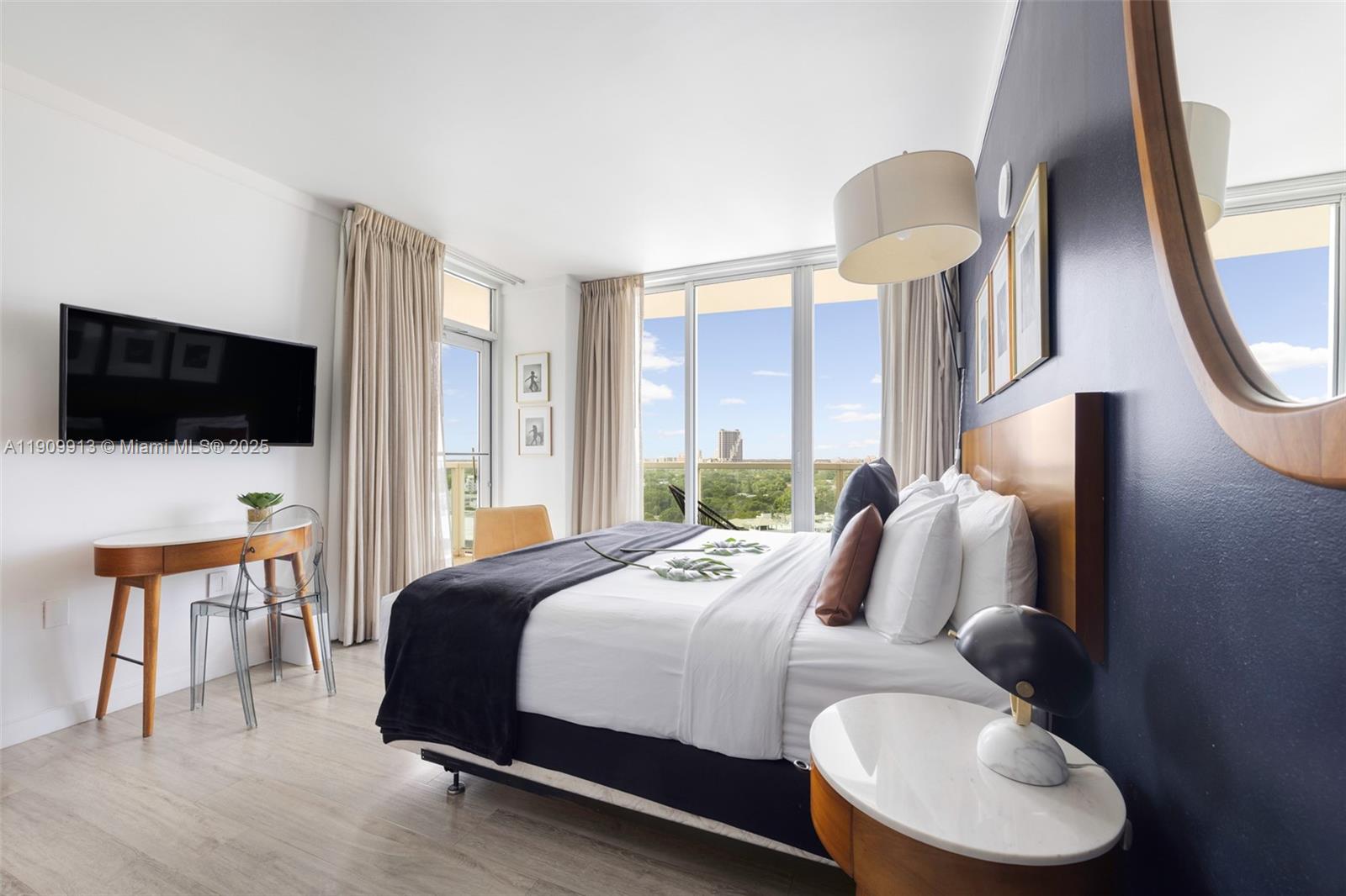 2889 McFarlane Road, Unit 1512 Coconut Grove, FL 33133 - Photo 11 of 25 a bedroom with a bed and tv