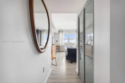 a view of a balcony with an outdoor seating