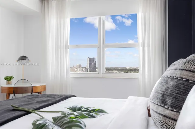 a view of swimming pool with outdoor seating and city view