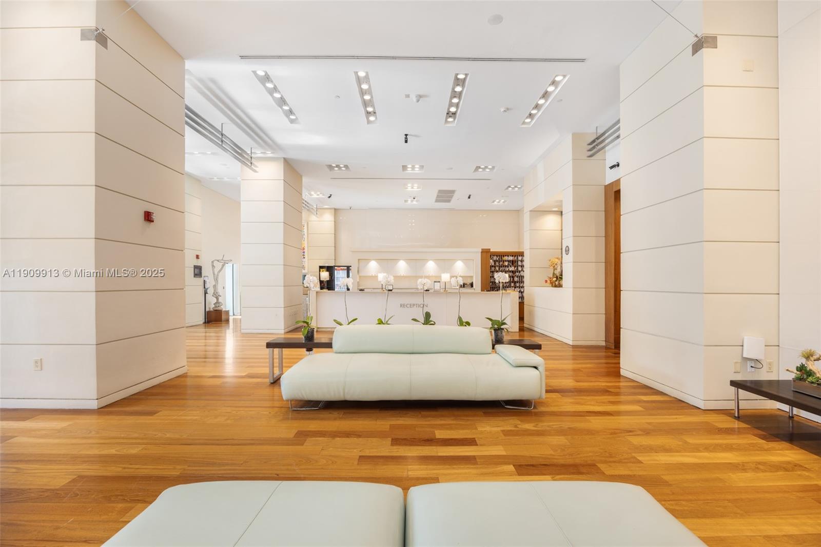 2889 McFarlane Road, Unit 1512 Coconut Grove, FL 33133 - Photo 4 of 25 a living room with furniture and a chandelier