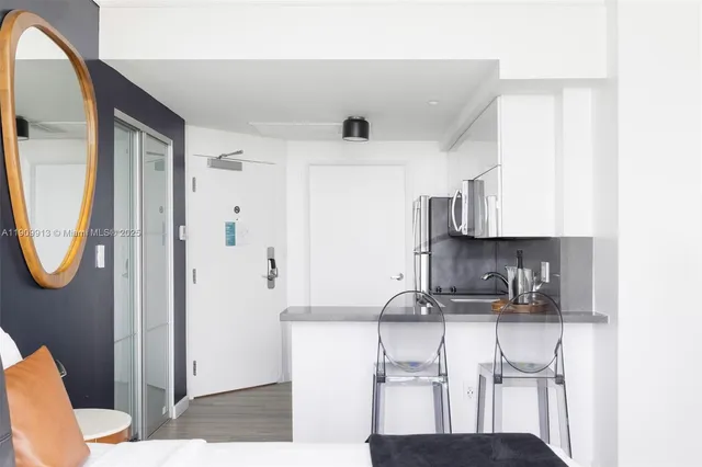 a kitchen with stainless steel appliances a refrigerator stove microwave and sink