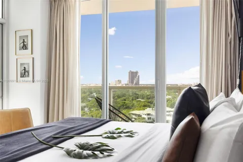 a bedroom with a bed and tv