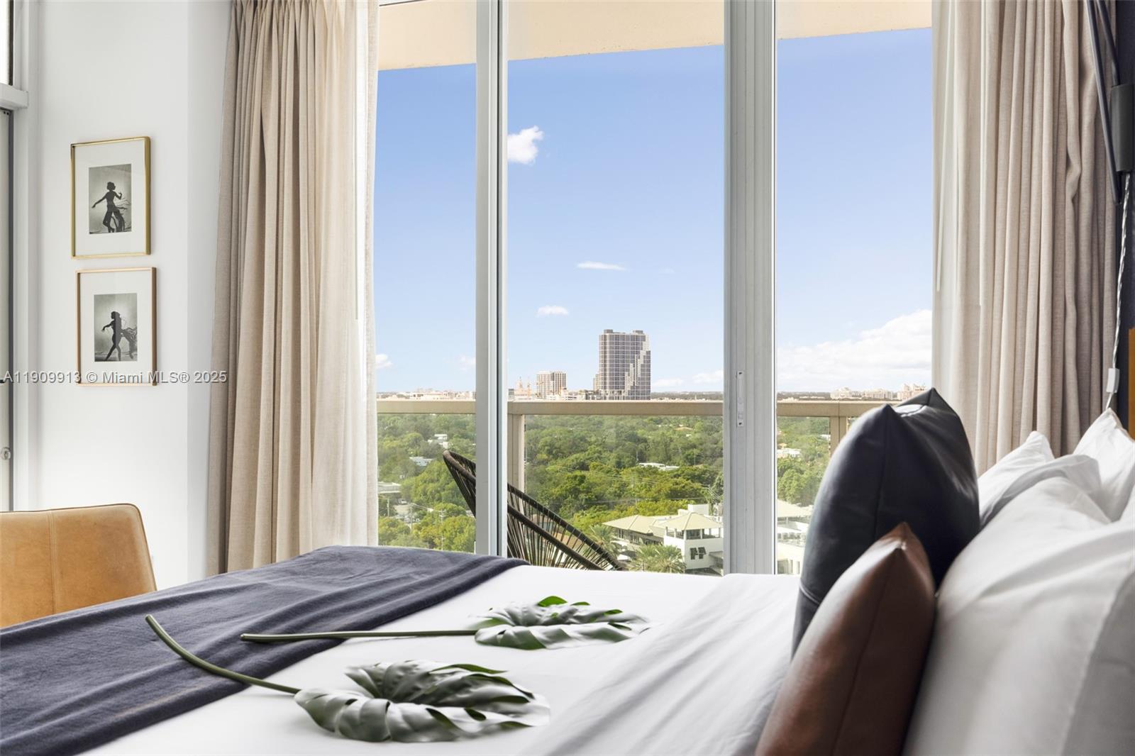 2889 McFarlane Road, Unit 1512 Coconut Grove, FL 33133 - Photo 9 of 25 a living room with furniture and a large window