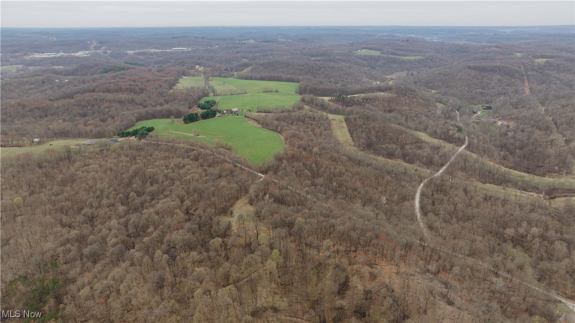 7146 Crowder Road Southwest Sherrodsville, OH 44675 - Photo 18 of 33 Aerial view featuring a wooded view