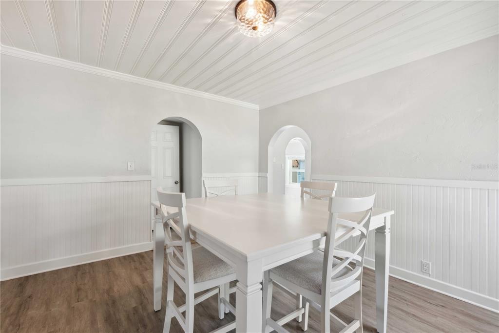 113 West Noble Avenue Bushnell, FL 33513 - Photo 11 of 56 a view of a dining room with furniture and wooden floor