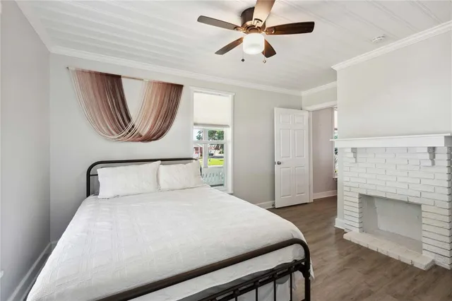 a bedroom with a bed and a fireplace