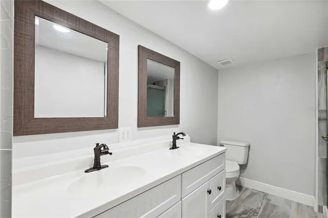 a bathroom with a sink and mirror