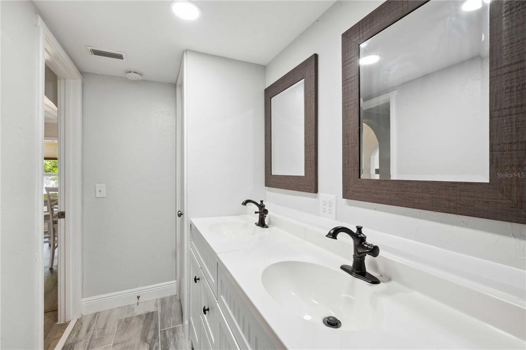 113 West Noble Avenue Bushnell, FL 33513 - Photo 31 of 56 a bathroom with a sink and a mirror