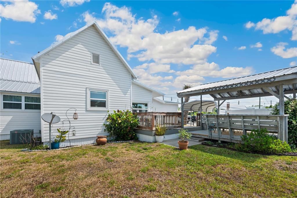 113 West Noble Avenue Bushnell, FL 33513 - Photo 32 of 56 a view of a house with backyard and sitting area