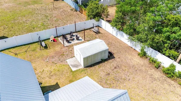 an aerial view of a house with swimming pool