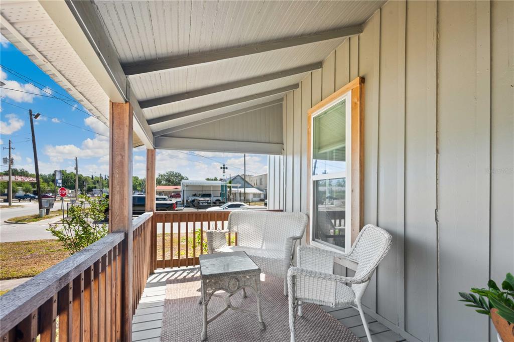 113 West Noble Avenue Bushnell, FL 33513 - Photo 6 of 56 a view of a balcony with furniture