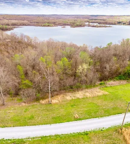 a view of a lake with a big yard