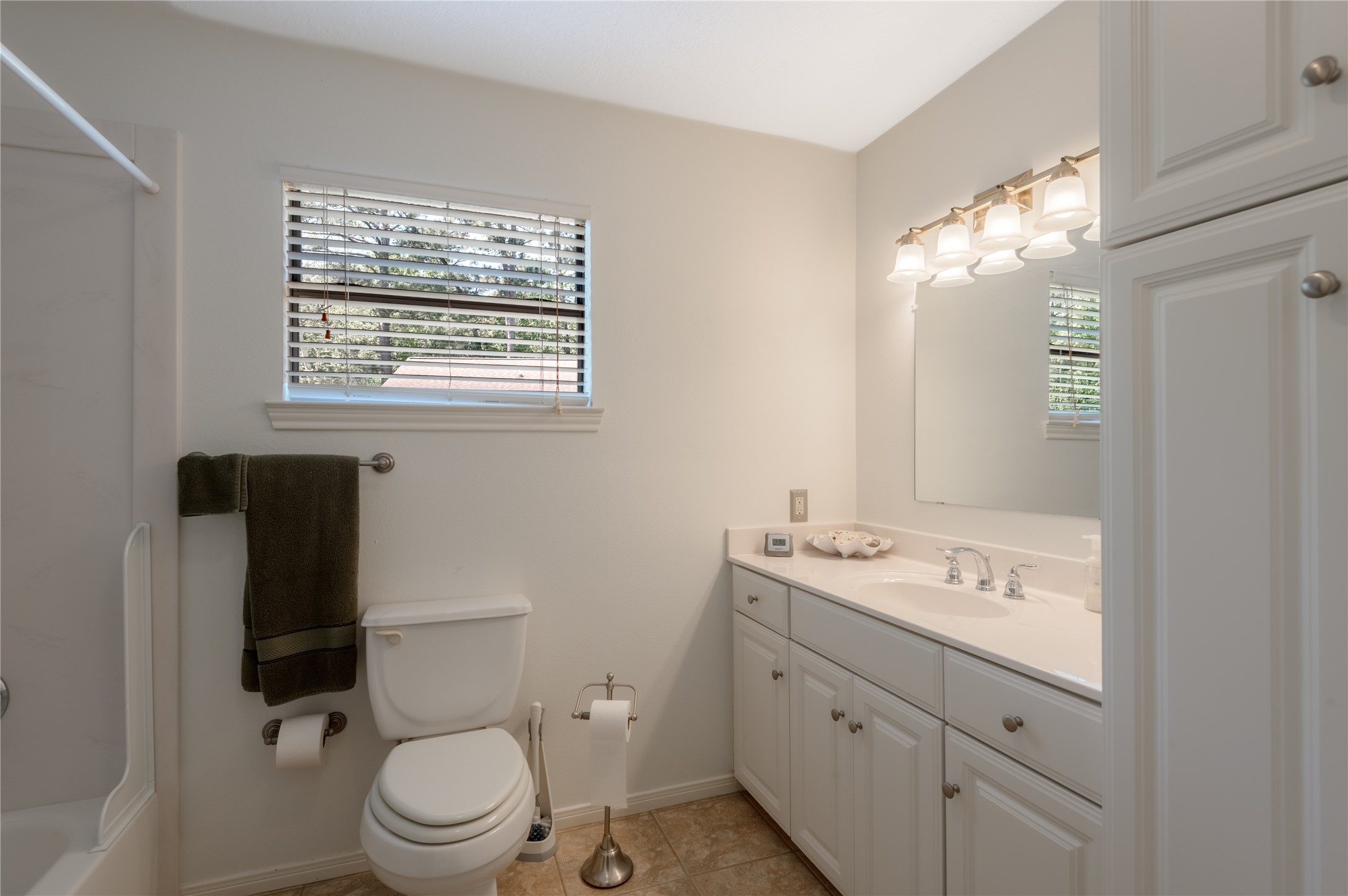 15 Lake Side Trinity, TX 75862 - Photo 22 of 33 a bathroom with a toilet sink and mirror