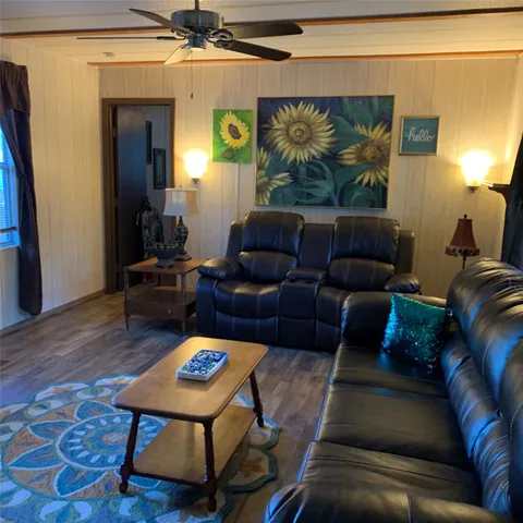 a living room with furniture and a rug