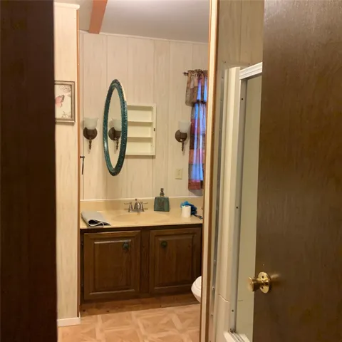 a bathroom with a sink and a mirror
