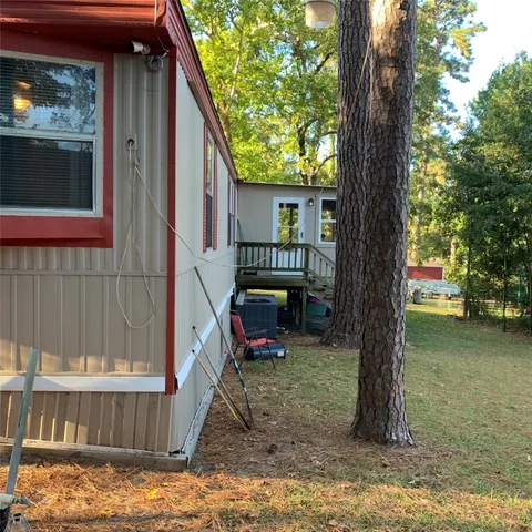 a view of a house with a tree in the background