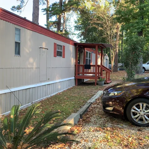 a view of a car park in front of a house