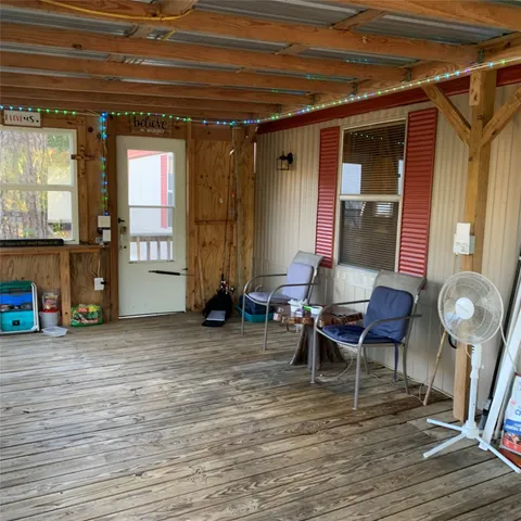 a view of a porch with seating space