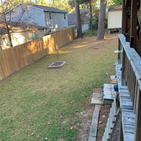 a view of a backyard with sitting area