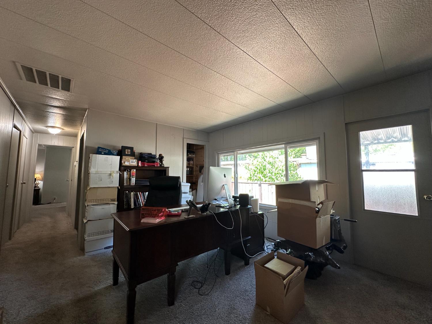14610 Mono Way, Unit 65 Sonora, CA 95370 - Photo 11 of 24 a view of a workspace with furniture and a window
