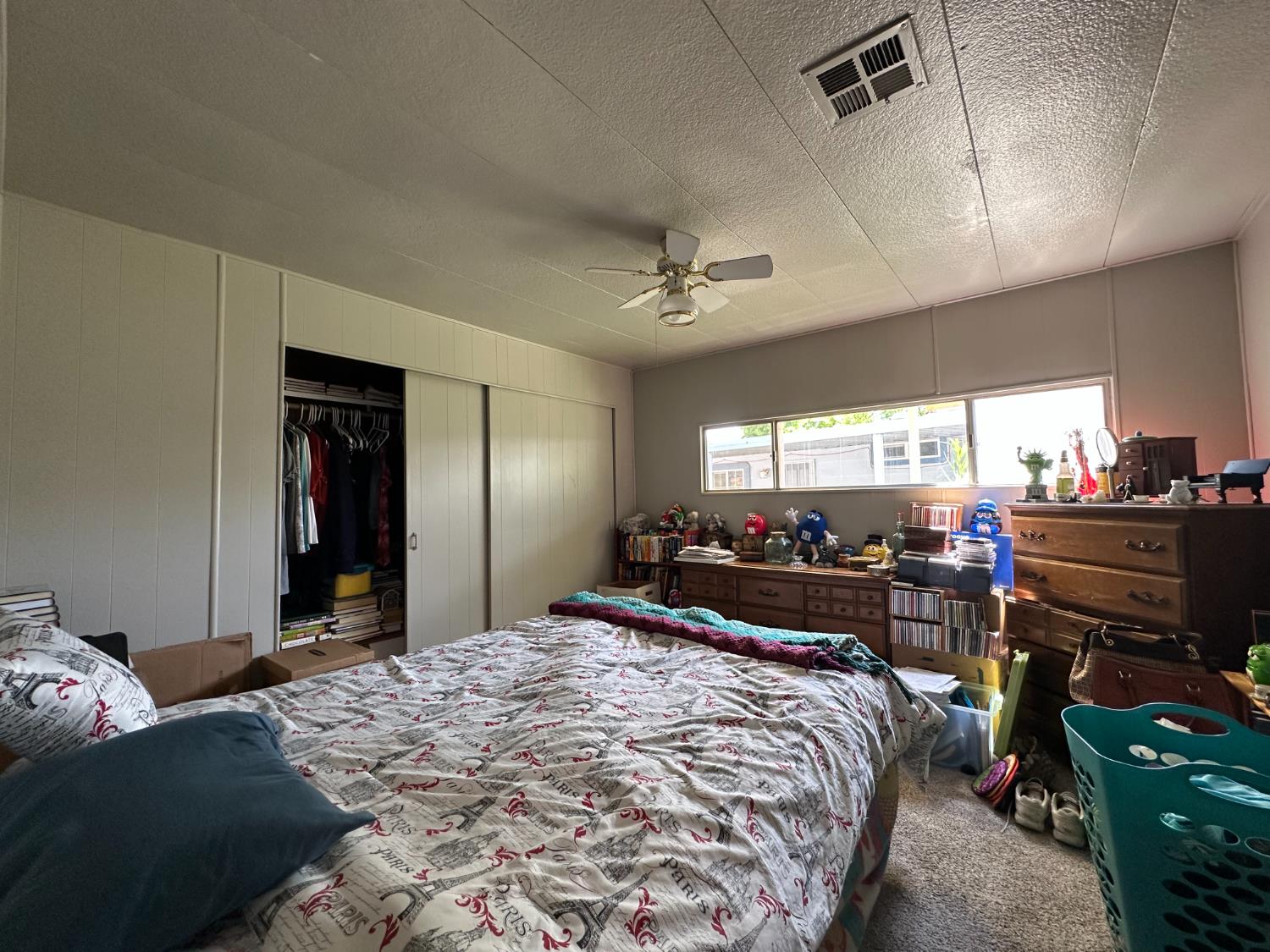 14610 Mono Way, Unit 65 Sonora, CA 95370 - Photo 12 of 24 a bed room with a bed and a television