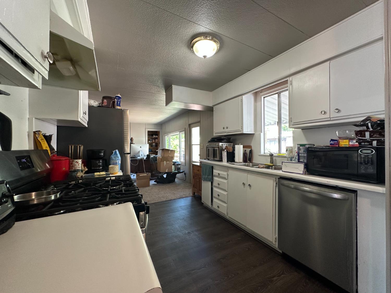 14610 Mono Way, Unit 65 Sonora, CA 95370 - Photo 13 of 24 a kitchen with lots of counter top space and a sink