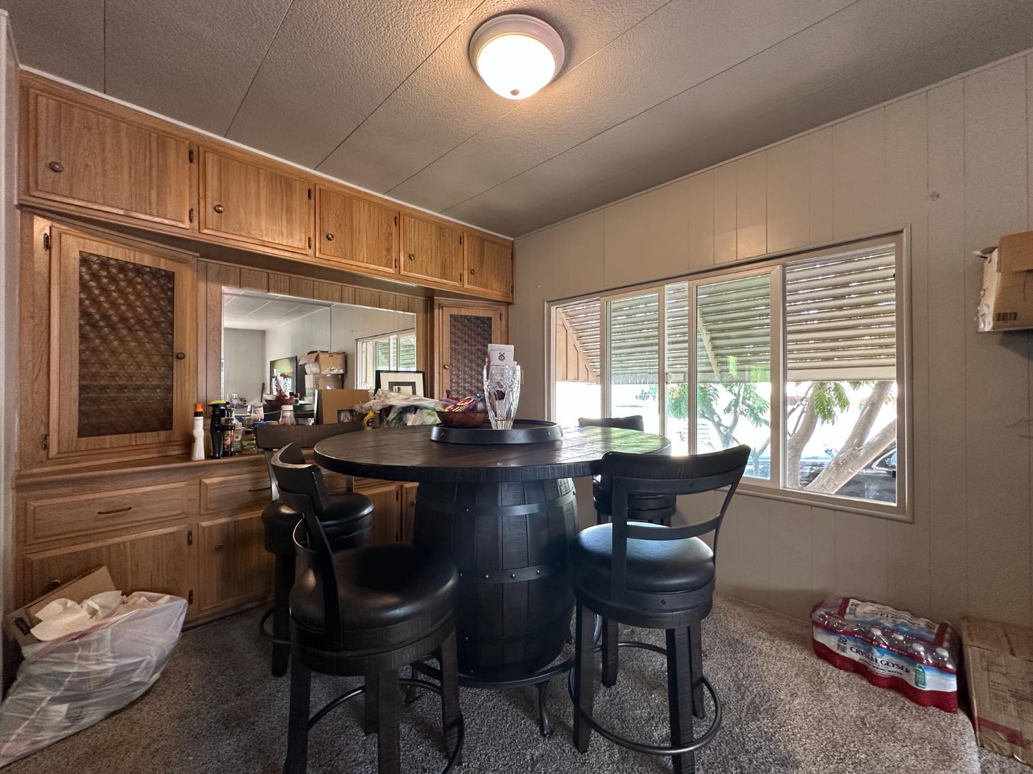 14610 Mono Way, Unit 65 Sonora, CA 95370 - Photo 14 of 24 a view of a dining room with furniture window and outside view