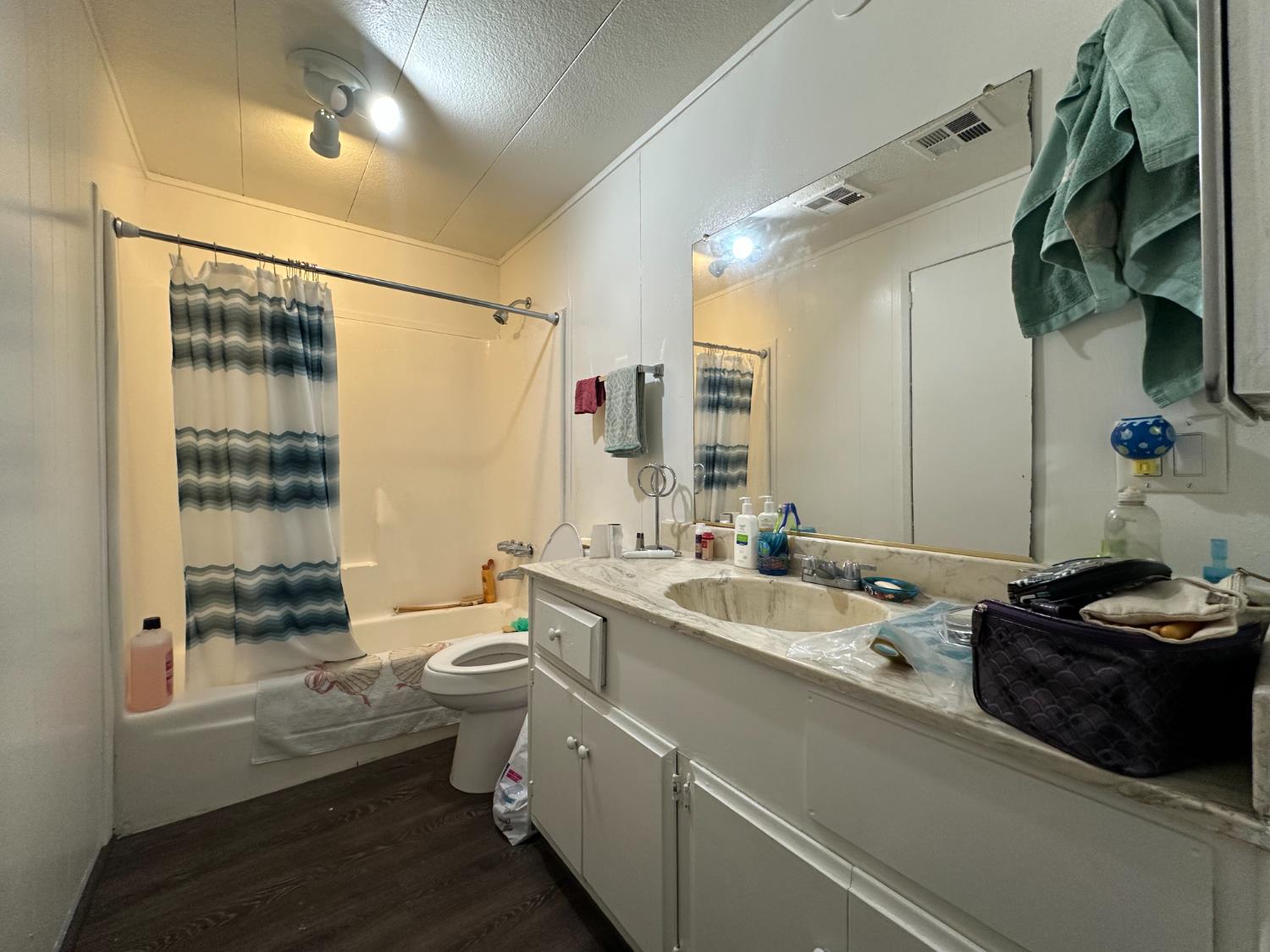 14610 Mono Way, Unit 65 Sonora, CA 95370 - Photo 17 of 24 a bathroom with a double vanity sink toilet and shower