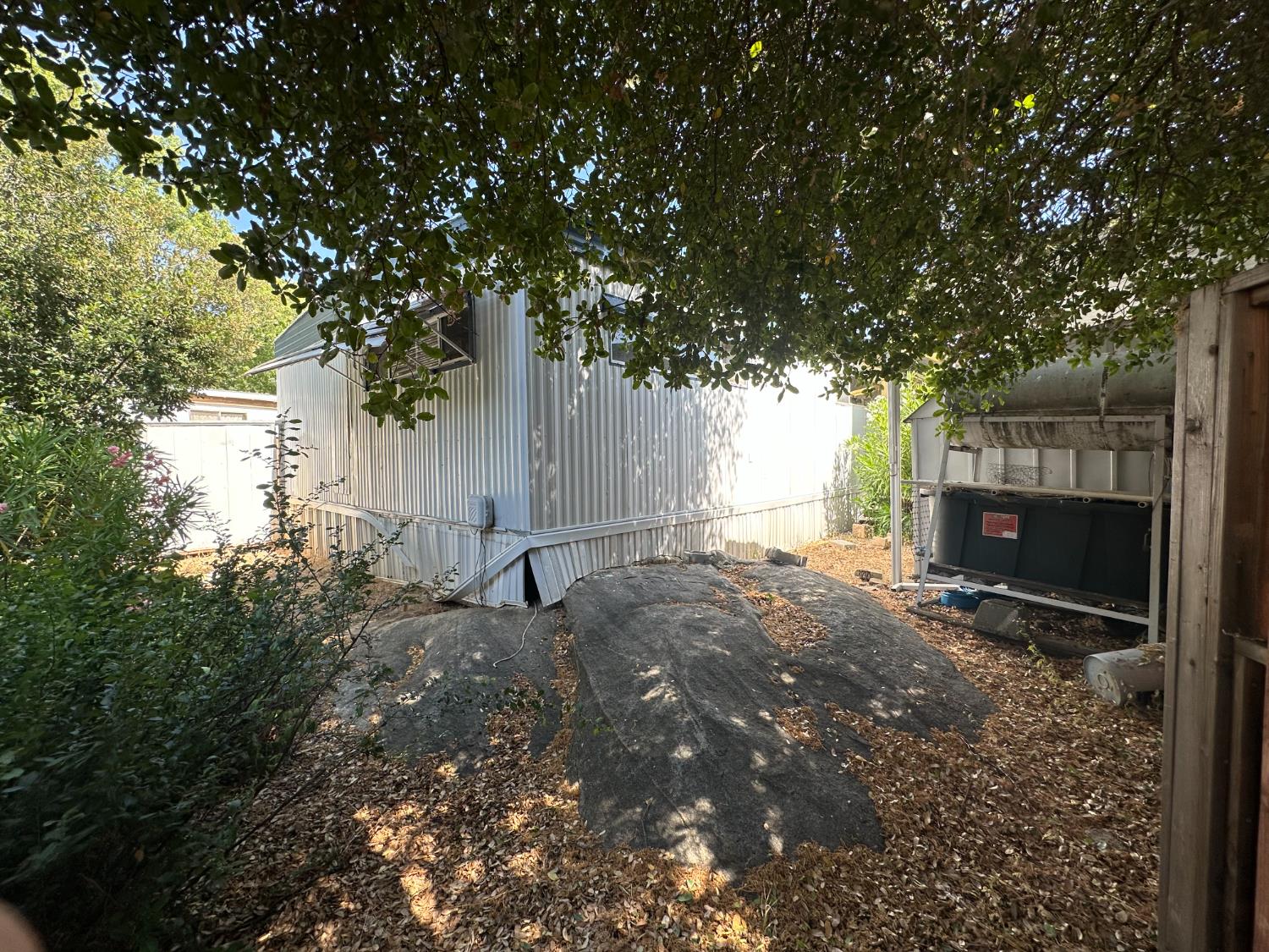 14610 Mono Way, Unit 65 Sonora, CA 95370 - Photo 20 of 24 a backyard of a house with yard and outdoor seating