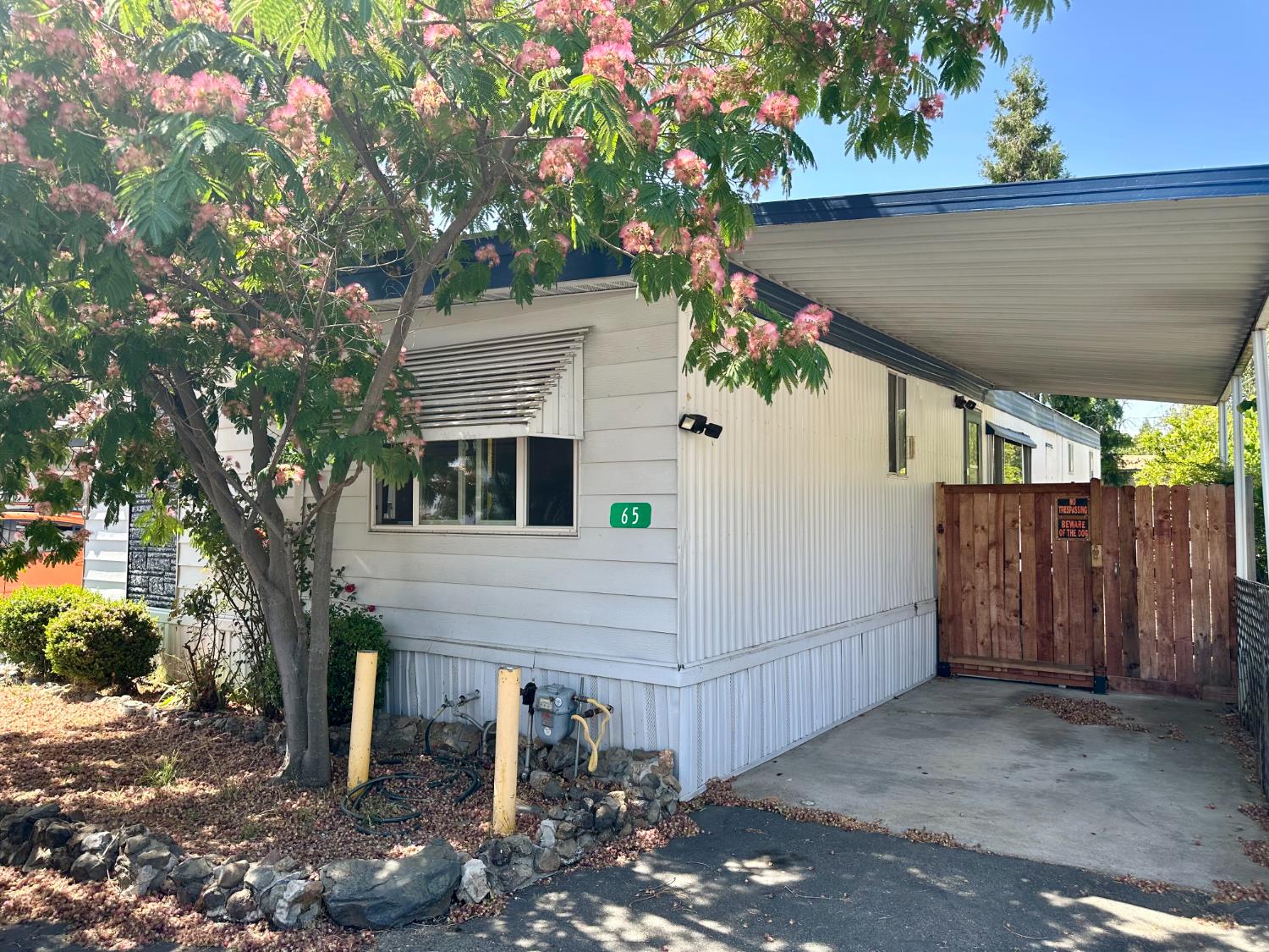 14610 Mono Way, Unit 65 Sonora, CA 95370 - Photo 2 of 24 a house view with a outdoor space
