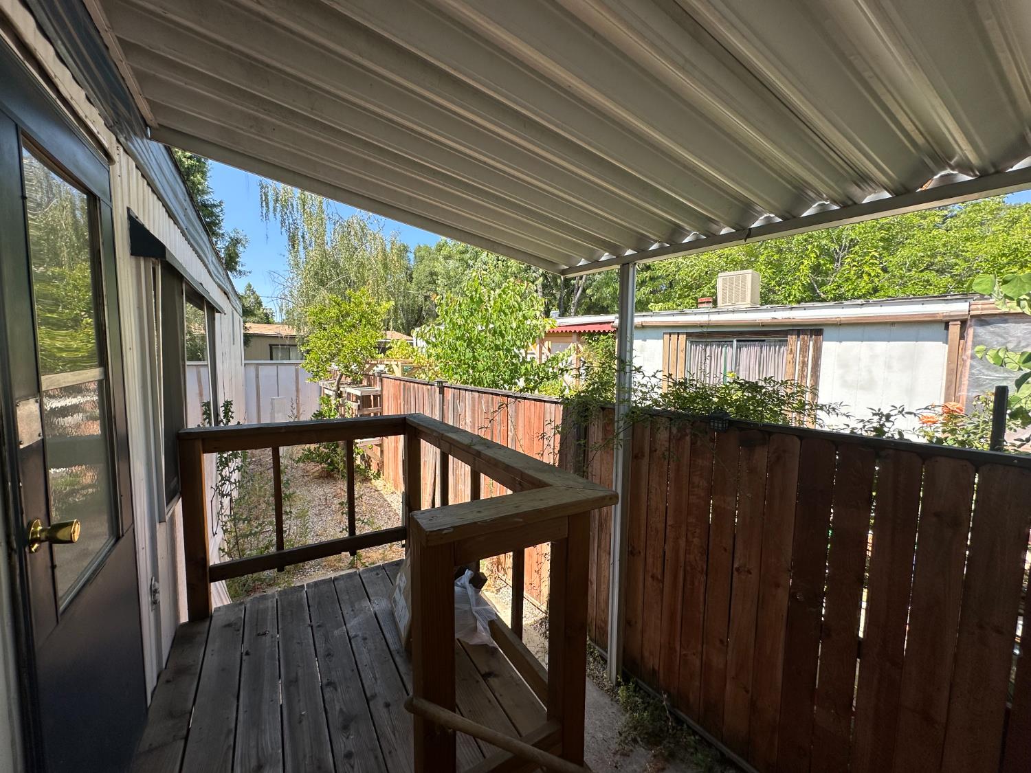 14610 Mono Way, Unit 65 Sonora, CA 95370 - Photo 21 of 24 a view of a balcony with wooden floor