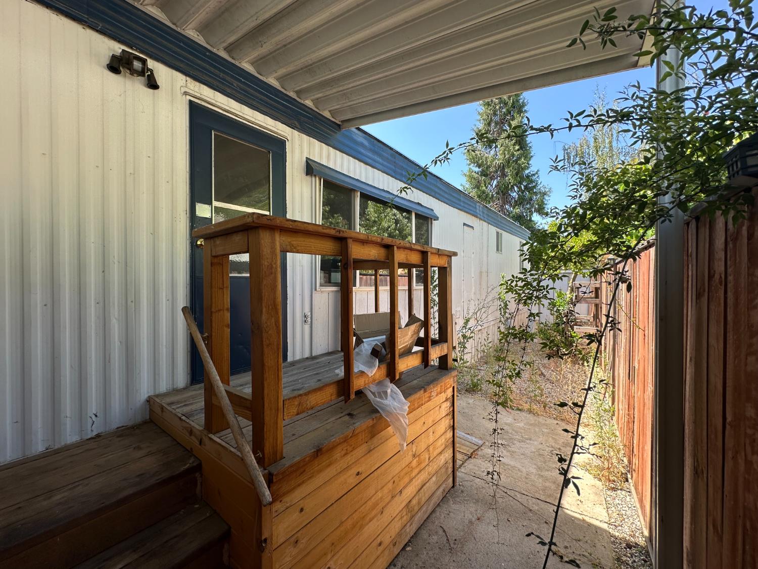 14610 Mono Way, Unit 65 Sonora, CA 95370 - Photo 22 of 24 a view of a porch with furniture and a yard
