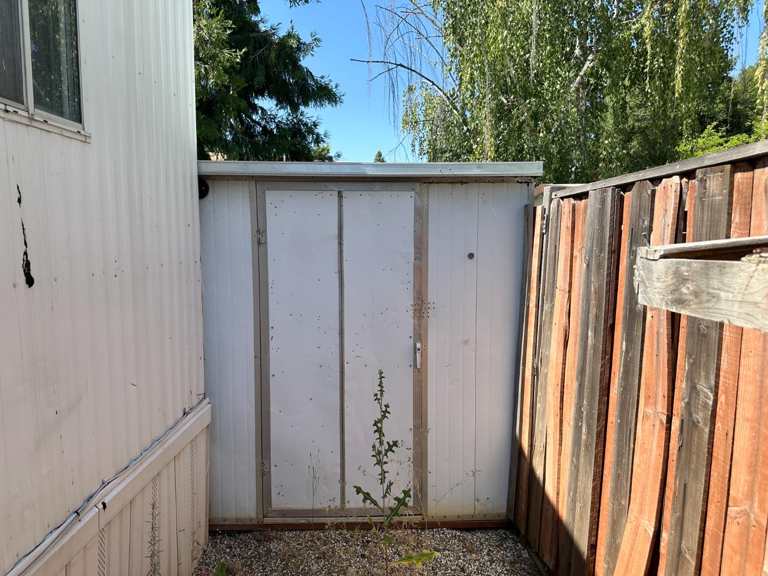14610 Mono Way, Unit 65 Sonora, CA 95370 - Photo 23 of 24 a view of a door and a wooden fence