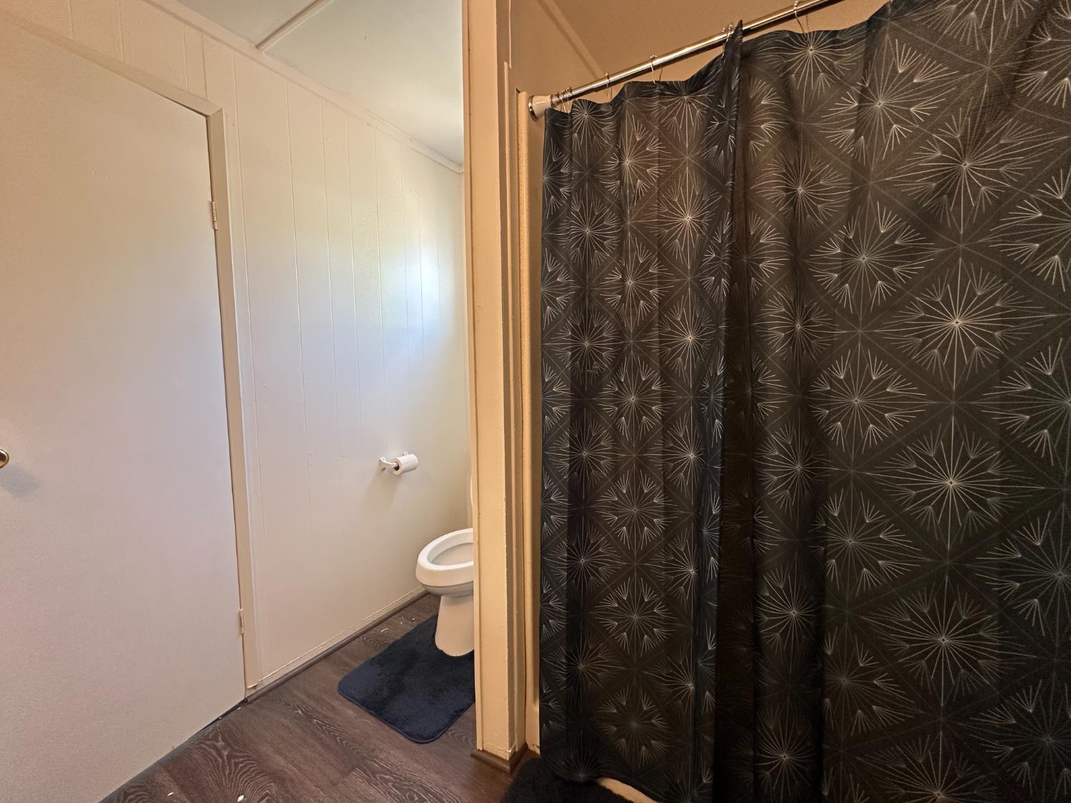 14610 Mono Way, Unit 65 Sonora, CA 95370 - Photo 7 of 24 a bathroom with a shower toilet and sink