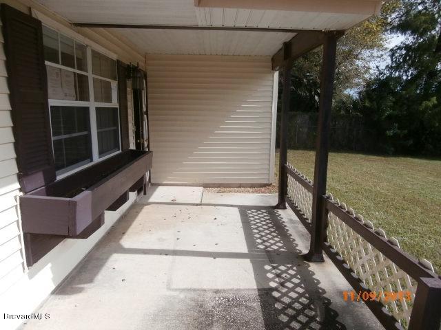 265 Benchor Road Northwest Palm Bay, FL 32907 - Photo 2 of 14 a view of a pathway of a house