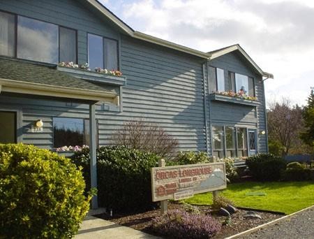236 Prune Alley Eastsound, WA 98245 - Photo 3 of 6 a view of a house with a small yard and plants
